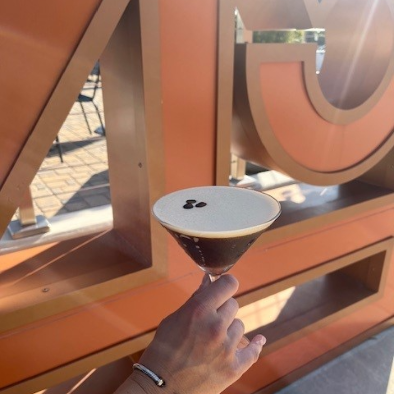 hand holding an espresso martini